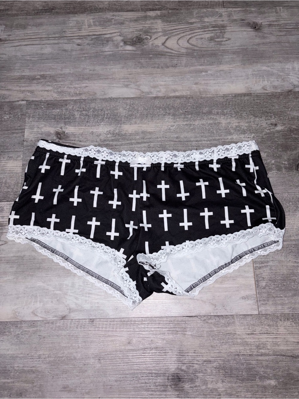 black mini shorts with white cross print